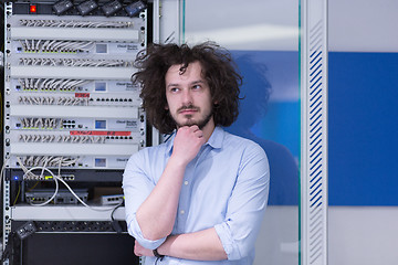 Image showing business man engeneer in datacenter server room