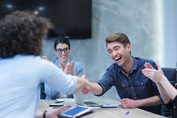 Image showing cloasing the deal in modern office interior