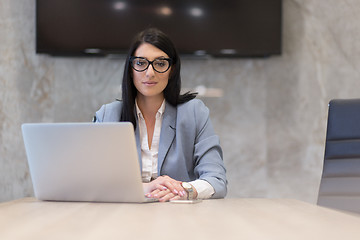 Image showing businesswoman using a laptop in startup office