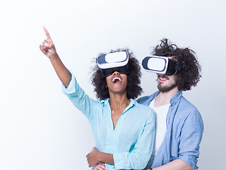 Image showing multiethnic couple getting experience using VR headset glasses