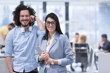 Image showing Business People Working With Tablet in startup office