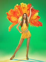 Image showing young beautiful dancer posing on studio background