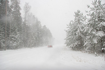 Image showing Beautiful winter landscape with snowy road in the winter forest.