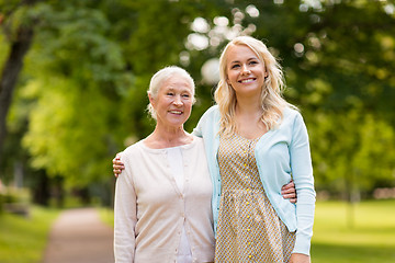 Image showing daughter with senior mother hugging at park