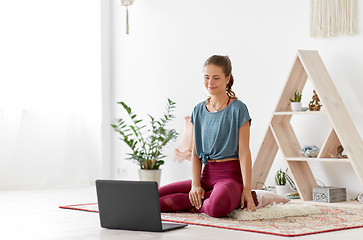 Image showing woman with laptop computer at yoga studio