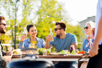 Image showing friends having dinner or bbq party on rooftop