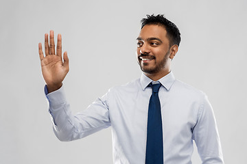 Image showing indian businessman working with virtual screen