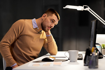 Image showing man with computer working late at night office