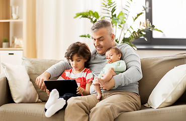 Image showing happy father with preteen and baby son at home