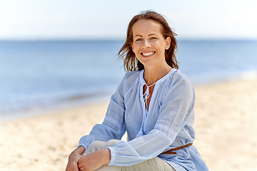 Image showing happy smiling woman on summer beach