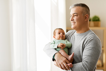 Image showing happy father holding with little baby son at home