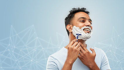 Image showing indian man shaving beard with razor blade