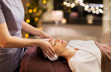 Image showing woman having face and head massage at spa parlor