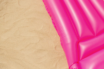 Image showing pink swimming mattress on beach