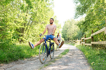 Image showing happy couple with bicycles at summer park