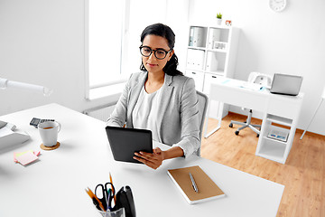 Image showing businesswoman with tablet computer at office