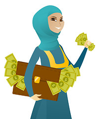 Image showing Muslim business woman with briefcase full of money