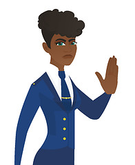 Image showing Young african stewardess showing stop hand gesture