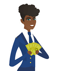 Image showing Young african-american stewardess holding money.