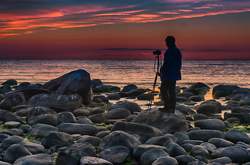 Image showing Photographer near baltic sea sunset