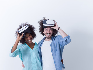 Image showing multiethnic couple getting experience using VR headset glasses