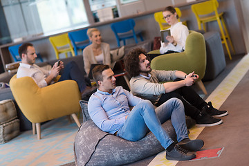 Image showing startup Office Workers Playing computer games