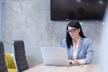 Image showing businesswoman using a laptop in startup office