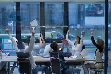 Image showing startup Group of young business people throwing documents