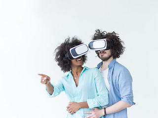 Image showing multiethnic couple getting experience using VR headset glasses