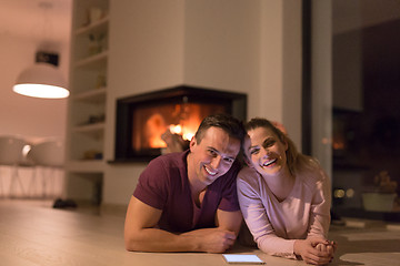 Image showing Young Couple using digital tablet on cold winter night