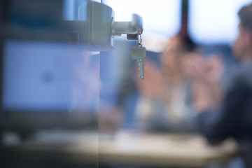 Image showing Open  glass door with keys