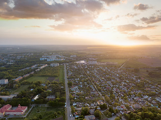 Image showing Aerial panoramic view from the drone to the national dendrological park Sofiyivka and the city of Uman, Ukraine in the summer at sunset