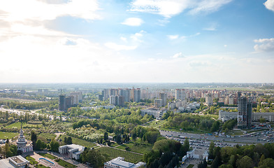 Image showing The panoramic bird\'s eye view shooting from drone to modern city district with urban infrastructure and residential buildings of Kiev, Ukraine at summer sunset.