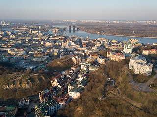 Image showing A bird\'s eye view, aerial view shooting from drone of the Podol district, oldest historical center of Kiev, Ukraine, the Dnieper River and the left bank of Dnieper