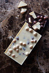 Image showing pieces of dark and white chocolate