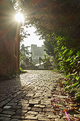 Image showing Street with old traditional houses and filigree sidewalk