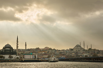 Image showing Beautiful scenic seascape landscape with light of sunbeam through clouds to the town