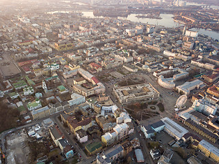 Image showing The panoramic bird\'s eye view from drone to the central historical part of the city Kiev - the Podol district, the Dnieper River in Kiev, Ukraine at summer sunset.