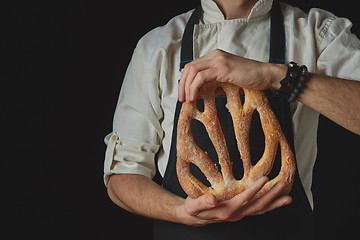 Image showing Hands men holding fougas bread