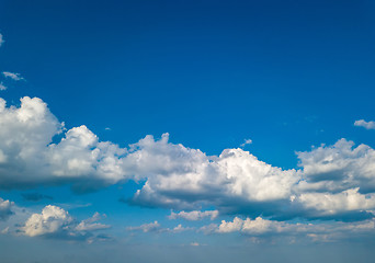 Image showing Beautiful clouds with blue sky background at summer sunset. Aerial view from drone.