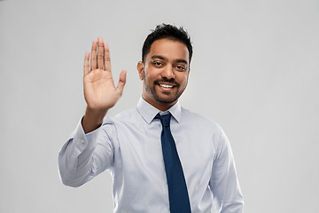 Image showing indian businessman making high five gesture