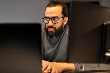 Image showing close up of creative man working at night office