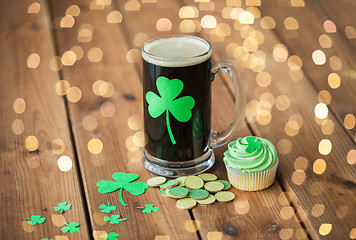 Image showing shamrock on glass of beer, green cupcake and coins