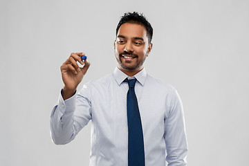 Image showing indian businessman in shirt with tie over grey