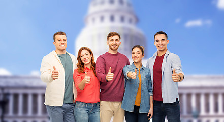 Image showing friends showing thumbs up over capitol building