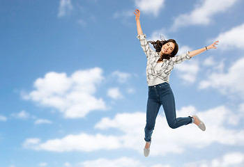 Image showing happy young woman or teenage girl jumping