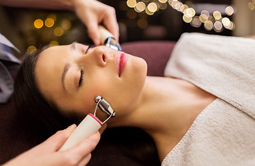 Image showing woman having hydradermie facial treatment in spa