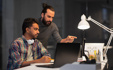 Image showing creative team with computer working late at office