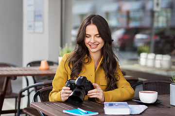 Image showing tourist or teenage girl with camera at city cafe