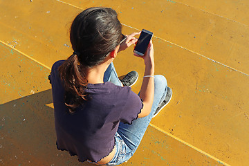 Image showing Young girl use smartphon